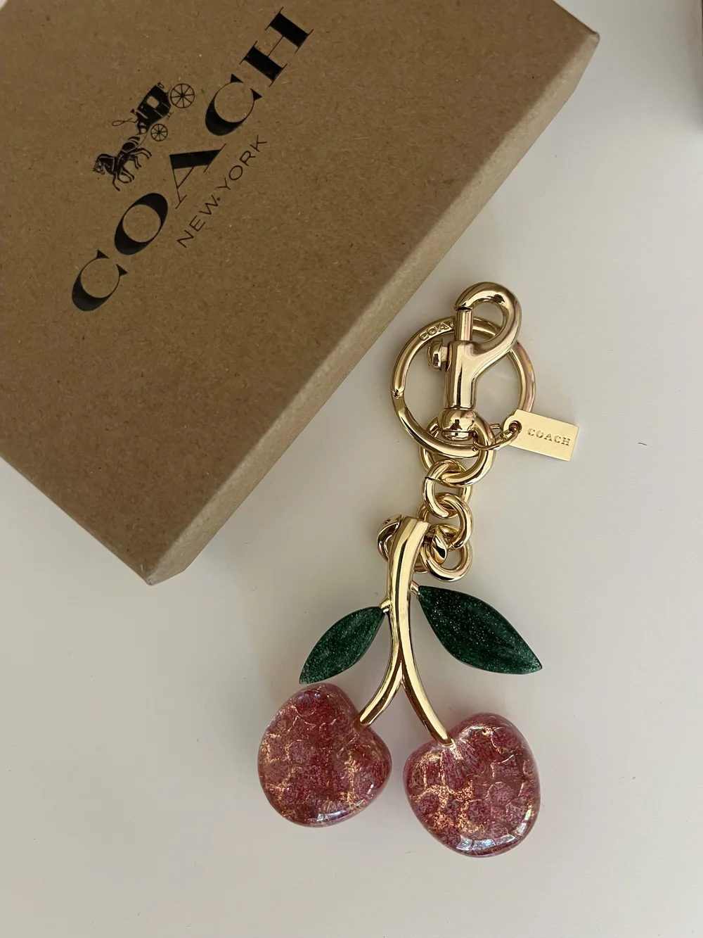 Coach Gold-Tone Cherry Key Charm with Pink Glitter Cherries and Green Leaves
